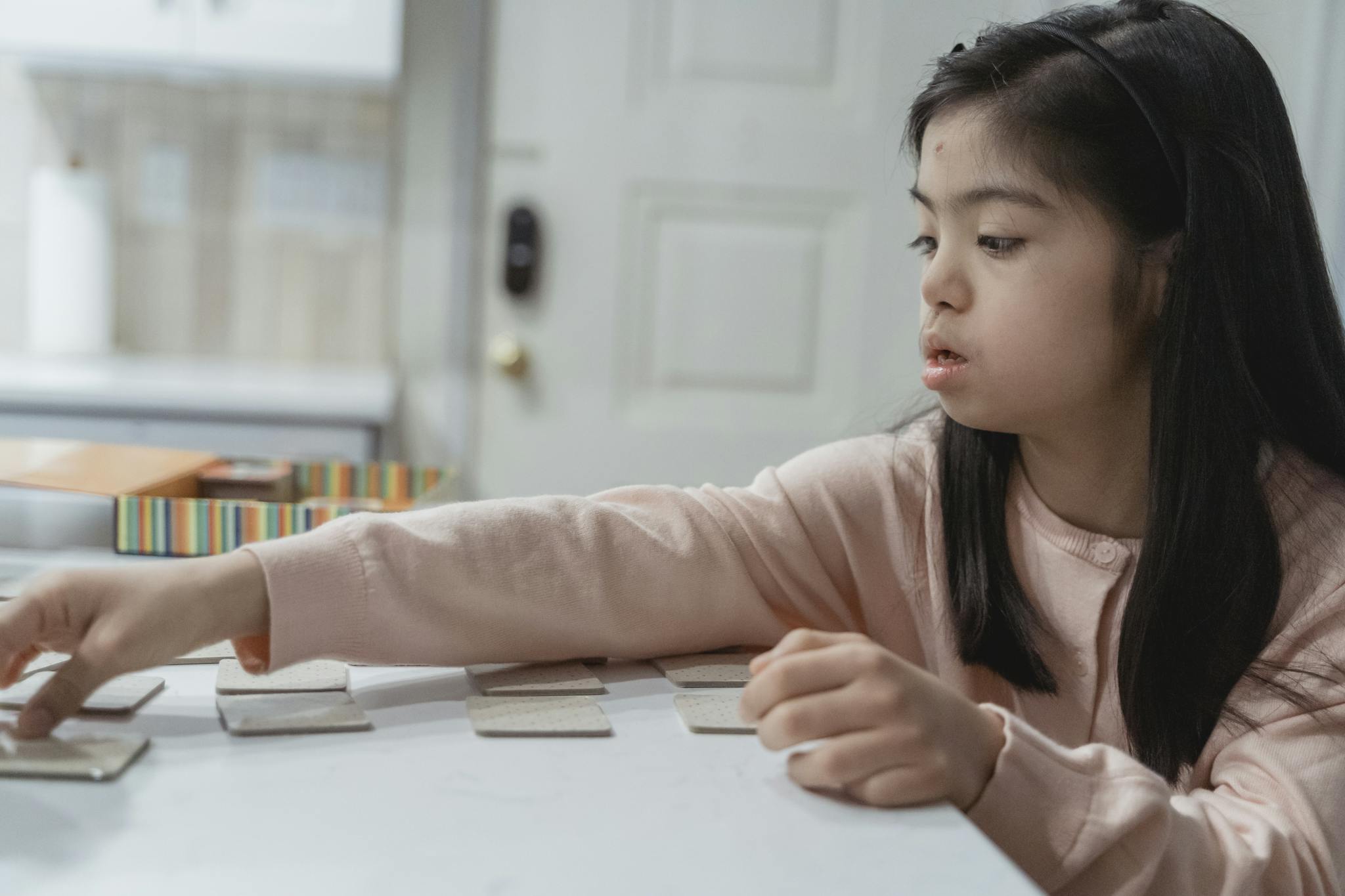 A Young Girl in Pink Sweater